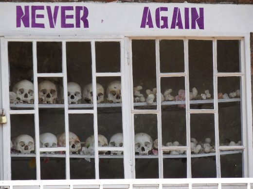 never_again_-_with_display_of_skulls_of_victims_-_courtyard_of_genocide_memorial_church_-_karongi-kibuye_-_western_rwanda_-_02