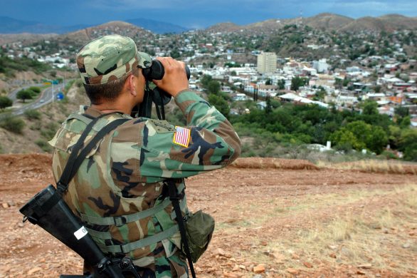 a-national-guard-soldier-armed-with-an-m16-weapon-stands-watch-scanning-the-c2dc3b-1600